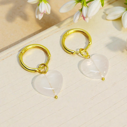 Gold hoop earrings with heart shaped pink stone