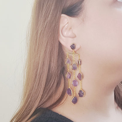 Model wearing Gemsara amethyst waterfall earrings in gold – raw crystal statement jewellery