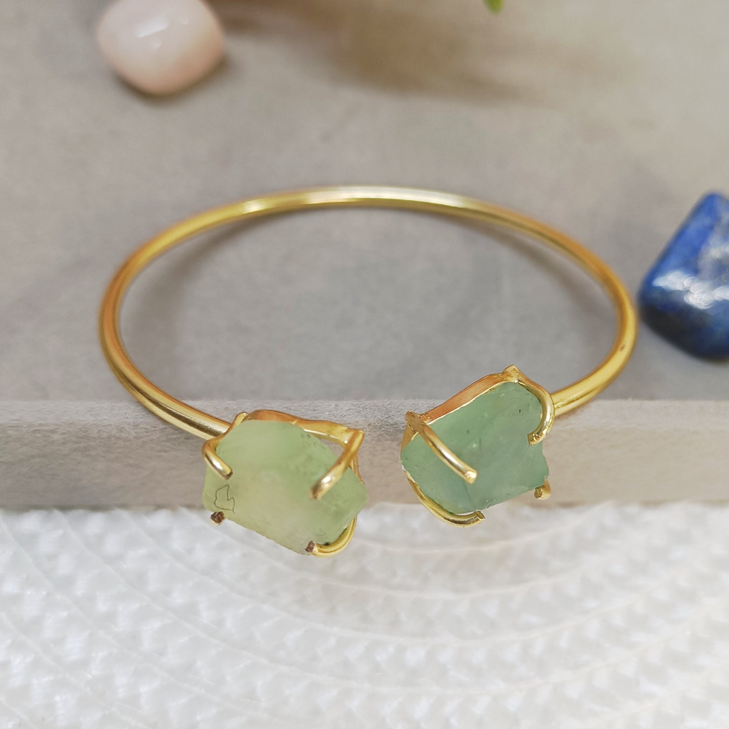 Green flourite stone bangle with golden adjustable cuff design, natural crystal jewelry. 