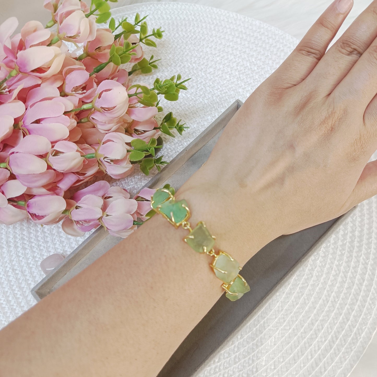 raw flourite brass bracelet, raw crystal brass bracelet on wrist, light green raw stone bracelet on a wrist
