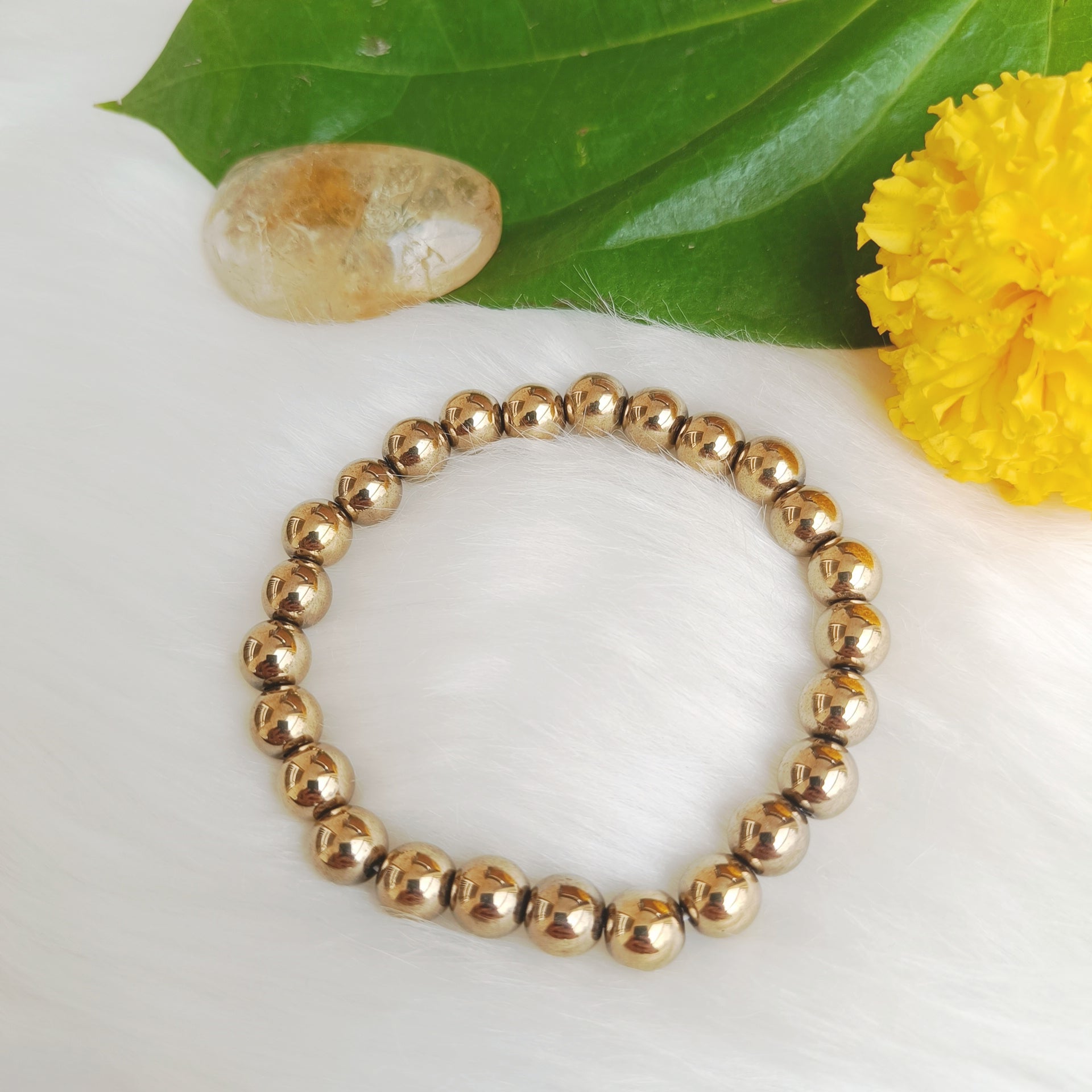 Handcrafted Golden Hematite Bracelet with a metallic gold shine — designed to ground your energy, boost focus, and radiate confidence by Gemsara.