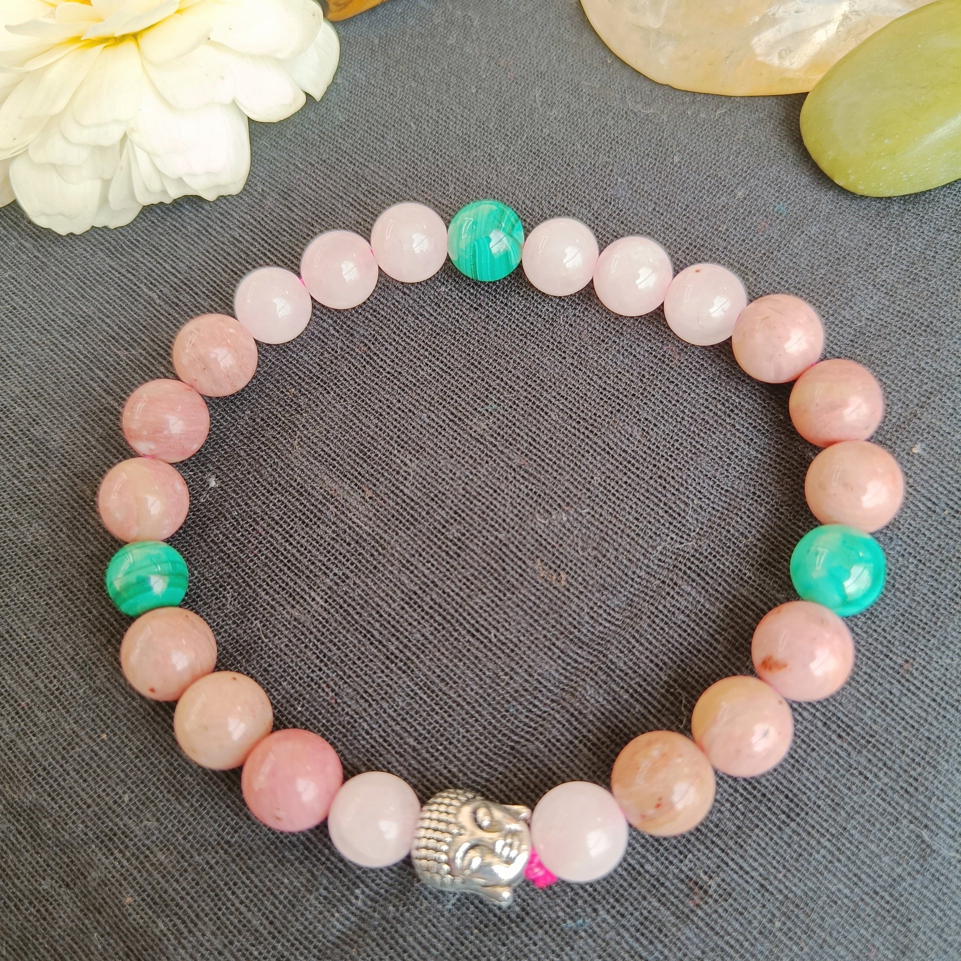 Beaded bracelet with rhodochrosite, rose quartz and malachite. This is heart chakra stone combination