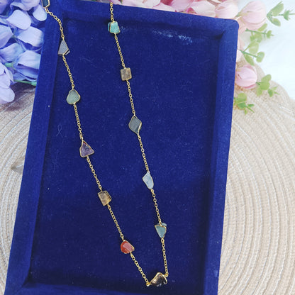 Close-up of multicolor gemstone long chain on navy velvet tray – Gemsara Jewelry
