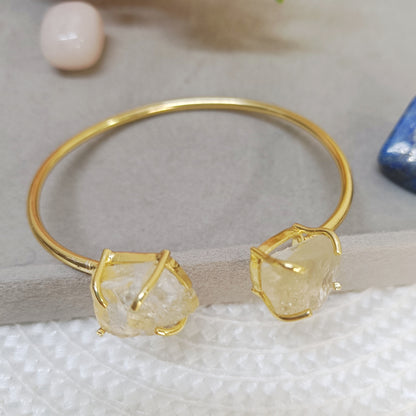 Yellow citrine stone bangle with golden adjustable cuff design, natural crystal jewelry. 