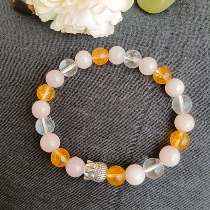 Beaded real stone Rose quartz and citrine quartz bracelet with a Buddha bead- also known as early marriage combination