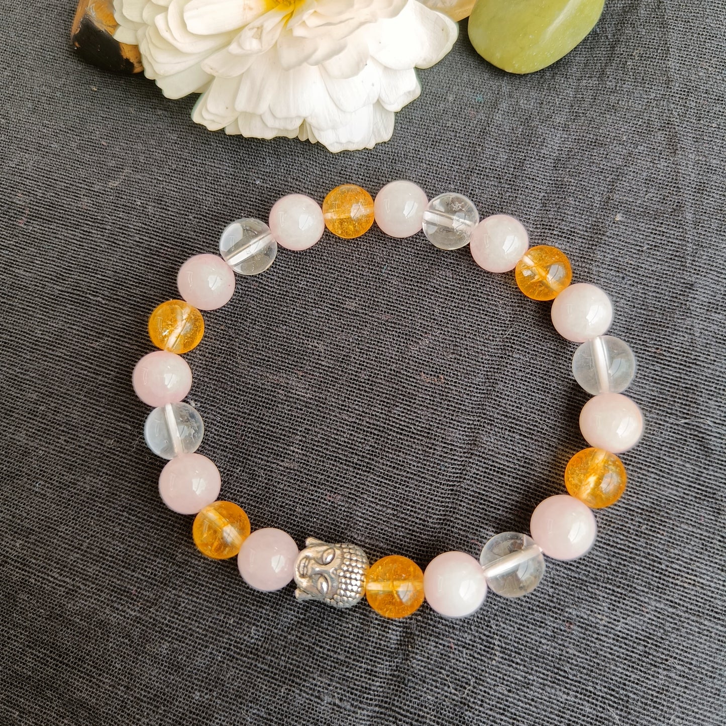 Rose quartz and citrine quart bracelet with natural stones  with a Buddha bead- also known as early marriage combination