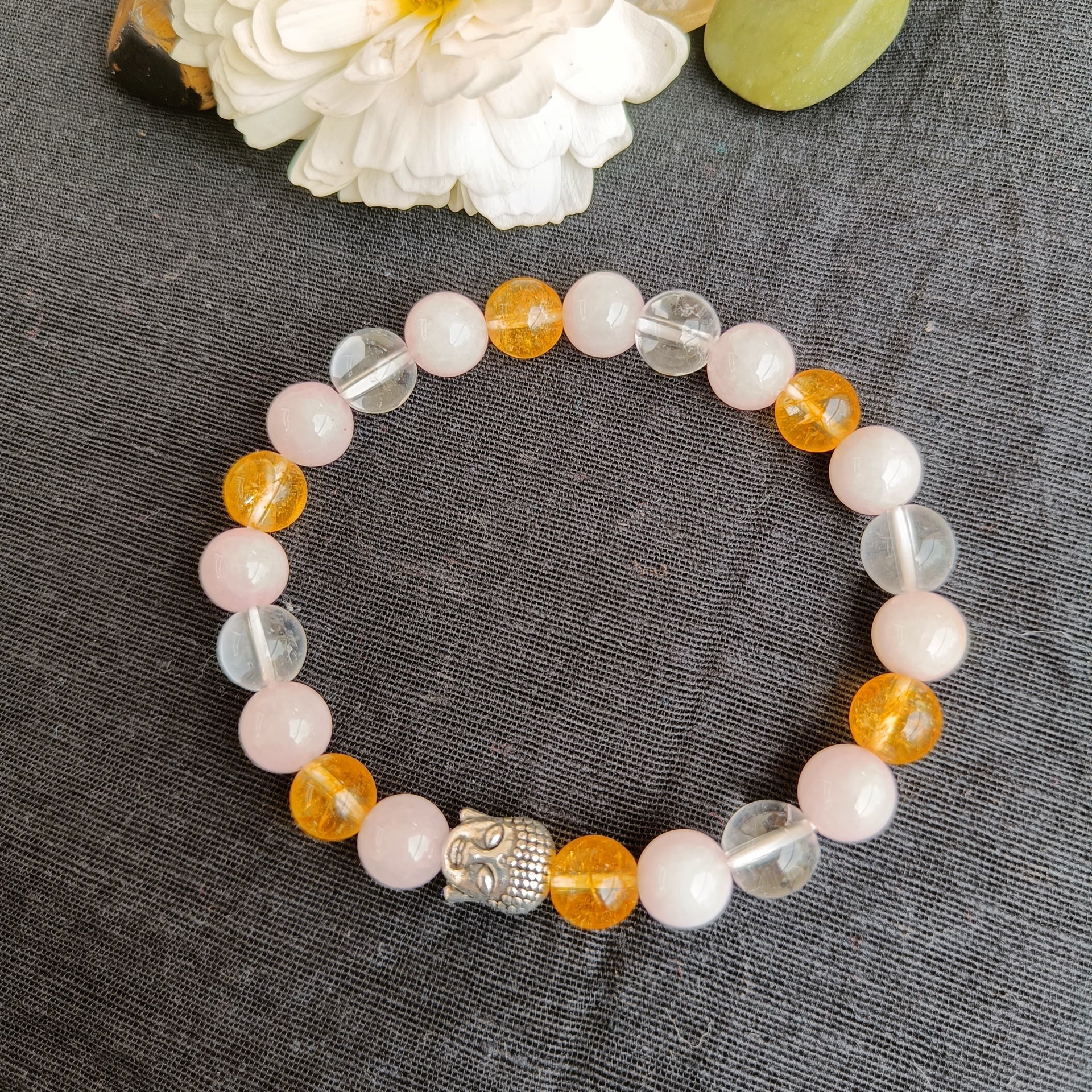 Rose quartz and citrine quart bracelet with natural stones  with a Buddha bead- also known as early marriage combination