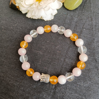 Rose quartz and citrine quart bracelet with natural stones  with a Buddha bead- also known as early marriage combination
