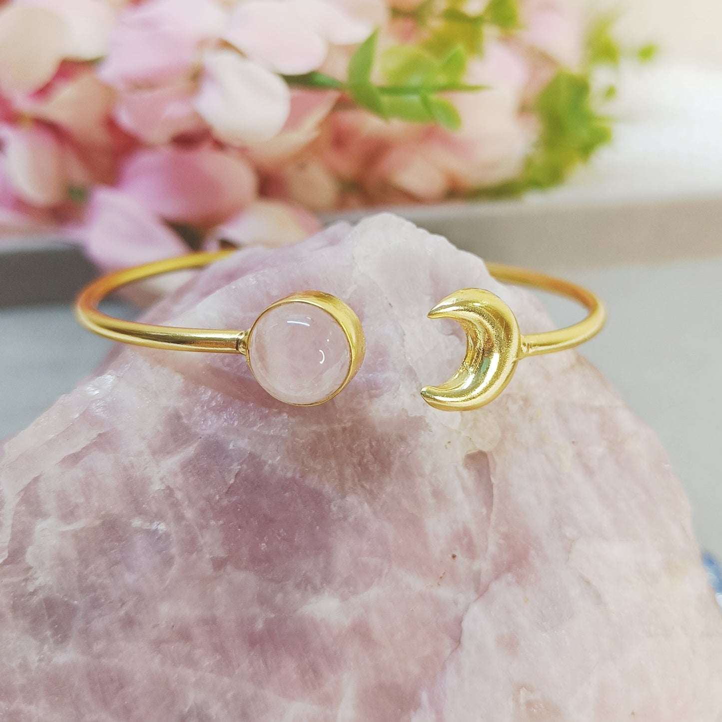 Gold-plated adjustable bracelet with natural Rose quartz crystal and brass moon charm on a pink stone