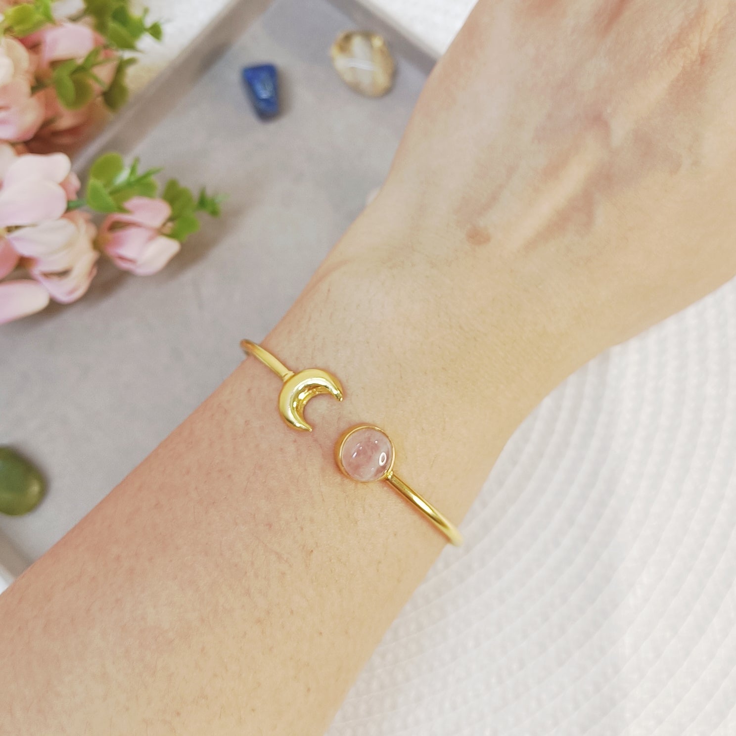 Gold-plated cuff bracelet with natural Rose quartz crystal and brass moon charm 