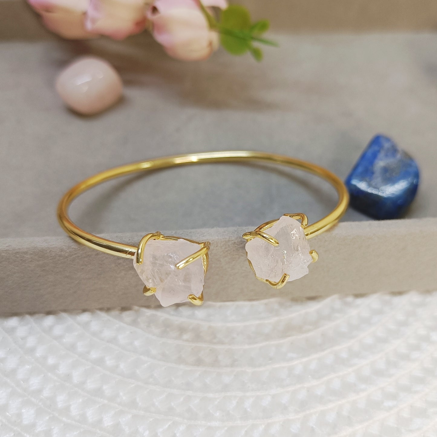 Gold-plated brass bracelet with natural pink rose quartz crystal, adjustable handcrafted bangle.